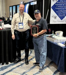 Jerry Whitehead receives the Krupnik & Stempkowski Lifetime Achievement Award from the Midwest Pawnbrokers Association in May of 2023
